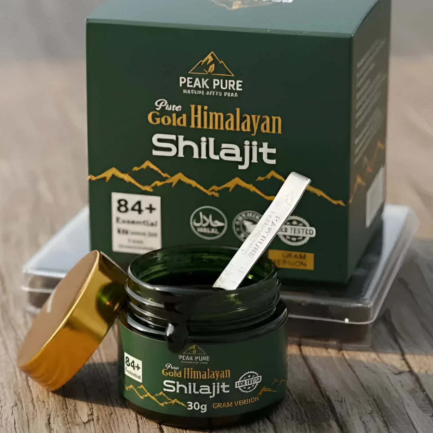 Peak Pure Gold Himalayan Shilajit jar and packaging on a wooden surface